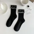 Black mid-tube socks with pearl and wavy lace trim, elegant design for women. - One Size (EU 34-39) / Black