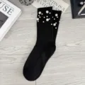 Black ribbed knit socks for women featuring elegant pearl embellishments, stylish mid-calf length. - One Size (EU 34-39) / Black