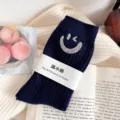 Navy blue ribbed mid-calf socks featuring sparkling rhinestone smiley face design. - One Size (EU 34-39) / Navy Blue