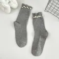 Grey ribbed mid-calf socks featuring elegant pearl and rhinestone embellished cuffs. - One Size (EU 34-39) / Gray