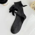 Dark grey ribbed mid-calf socks featuring black bowknot and elegant pearl decor for women. - One Size (EU 34-39) / Dark Gray
