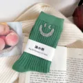 Green ribbed mid-tube socks featuring a rhinestone winking smiley face design for autumn winter. - One Size (EU 34-39) / Dark Green