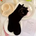 Cute black cotton mid-tube socks for girls with fluffy pom-pom and chic glasses decor. - L: 18-20 (Ages 6-8, EU 26-31) / Black Socks with Black Pompoms