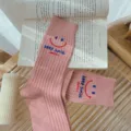 Pink ribbed mid-calf socks featuring cute smiley face and letter print, comfortable everyday wear. - One Size 34-39 / Pink