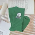 Green ribbed mid-calf socks for women featuring cute smiley face patch and happy letter design. - One Size (EU 34-39) / Green