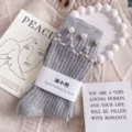Gray ribbed mid-calf socks decorated with elegant white pearl smiling face and paper band design. - One Size (EU 34-39) / Light Gray