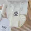 White ribbed crew socks featuring a cute smiley face and happy letter print for women. - One Size (EU 34-39) / Milk White