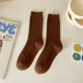 Brown crew socks for women, solid color ribbed knit casual fashion daily wear style footwear. - Coffee