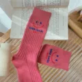 Pink ribbed crew socks with cute smiley face and letter embroidery for women daily wear. - One Size 34-39 / Dusky Pink