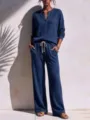 Detailed view of the women's waffle knit casual loungewear set featuring long sleeves and pants. - Burgundy