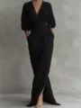 Elegant black maxi dress detail, featuring a deep V-neck, long sleeves, and practical pockets. - Black