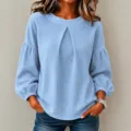 Hellblaues Waffelstrick Langarmshirt mit modischen Laternenärmeln und Rundhalsausschnitt. - Himmelblau
