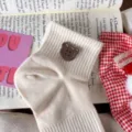 Cute beige short socks featuring a sweet brown bear button design, soft cotton knit material for women. - One Size / Beige with Coffee Buttons