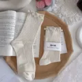 White ribbed mid-tube socks featuring elegant pearl and rhinestone embellishments, sweet and stylish. - One Size (EU 34-39) / Beige