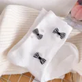 White ribbed mid-tube socks featuring chic black and white checkered bows and delicate pearls. - One Size (EU 34-39) / White