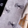 Grey knit mid-tube socks featuring black and white plaid bows and elegant faux pearl decor. - One Size (EU 34-39) / Light Gray