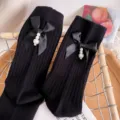 Black ribbed mid-tube socks featuring satin bow and pearl pendant, stylish autumn wear. - One Size (EU 34-39) / Black