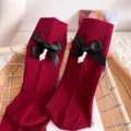 Burgundy mid-calf socks featuring black satin bows and elegant pearl pendant charms. - One Size (EU 34-39) / Burgundy
