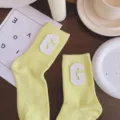 Macaron yellow mid-tube socks with white letter G leather patch, sweet collegiate style. - One Size 34-39 / Cream Yellow & White G