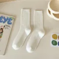 Classic solid white ribbed crew socks for women, stylish Korean style ins casual cotton socks. - Cream White