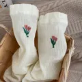 White mid-tube women socks with cute tulip embroidery and rolled edge design for daily wear. - One Size 34-39 / Milky White
