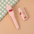 Pink cute cartoon foldable mini hair brush for portable daily styling and travel use. - Pink