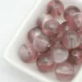 Gros plan détaillé de perles œil de chat gelée rose de 12mm, idéal pour les bijoux DIY. - 6. Gris rosé de rêve