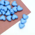 Close-up of light blue acrylic heart beads and charm for DIY jewelry and phone chain. - Blue