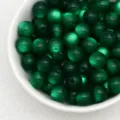 Green jelly cat eye resin beads close-up, perfect for DIY handmade bracelets jewelry making. - Dark Green