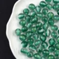 Detail shot of 16mm green glitter resin cat-eye beads, perfect for DIY handmade jewelry crafts. - 16mm / 10# Green - Candy Core