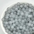 Close-up detail shot of translucent grey 4mm glass seed beads in bowl for DIY jewelry. - 100颗装 (4mm) / Light Gray