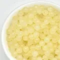 Close-up detail of light yellow 4mm loose beads, perfect for handmade DIY jewelry making. - 100颗装 (4mm) / Topaz Color