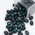 Perles ovales en resine pailletee etoilee de reve pour la creation de bijoux DIY - 8x11mm / Noir
