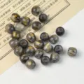 Detail shot of black and gold marbled barrel loose beads for DIY jewelry making. - 10# Black