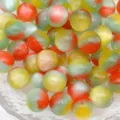 Close-up of colorful resin cat-eye round beads, smooth glossy finish for DIY jewelry crafting. - Style 6
