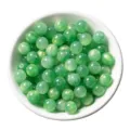 Green resin cat's eye round bead detail closeup, perfect for DIY handmade jewelry accessories. - Green