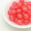 Pink glitter resin beads detail shot, sparkling jelly round beads for handmade DIY jewelry. - Red