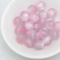 Close-up detail of pink and white cat eye beads showing smooth jelly texture and shiny surface. - 9. Dreamy Pink