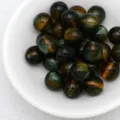 Close-up detail of dreamy jelly color imitation cat eye beads, perfect for DIY jewelry making. - 15. Dreamy Dark Green
