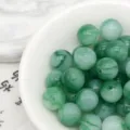 Close-up detail of green tie-dye acrylic beads, imitation jade loose beads for DIY jewelry crafts. - 8. Evening Jade