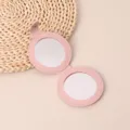 Espejo de maquillaje de bolsillo de cuero PU rosa, espejo cosmético de viaje redondo plegable. - Redondo / Rosa