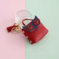 Mini bolso llavero de cuero PU con forma de búho rojo estuche para auriculares con borla - Rojo