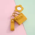 Gele PU lederen minitas sleutelhanger met bloem spiegel hanger en oortelefoon etui. - Geel