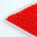 Red glass seed beads detail close up, small loose barrel beads for DIY handmade jewelry. - Bright Red