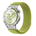 Detailed view of the green woven nylon watch strap with stainless steel connector and buckle. - 20mm / Field Green