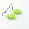 Close-up detail of cute green acrylic painted fish beads, perfect for DIY jewelry and crafts. - 21.7*14mm / Grass Green
