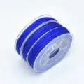 Close-up detail of royal blue 72 jade cord on a clear spool for DIY jewelry crafting. - 0.8mm (Approx. 10m) / Sapphire Blue