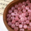 Pink glass cat's eye beads detail shot, perfect for DIY jewelry making and bracelets. - Pink
