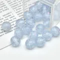 Close-up detail of light blue translucent opal resin glitter beads for DIY jewelry making accessories. - Light Blue