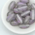 Close-up detail of 18mm mermaid glitter oval beads for DIY jewelry making, bracelets and necklaces. - Gray